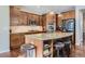 Kitchen includes stainless appliances, a large center island, granite countertops, and breakfast bar at 10935 Valleybrook Cir, Highlands Ranch, CO 80130