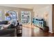 Spacious living room features hardwood floors and sliding glass doors to the backyard at 10935 Valleybrook Cir, Highlands Ranch, CO 80130