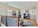 Bright living area with neutral tones, carpet, shutters, and lots of light at 10935 Valleybrook Cir, Highlands Ranch, CO 80130