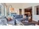Bright living room with hardwood floors and a view of the kitchen at 10935 Valleybrook Cir, Highlands Ranch, CO 80130