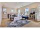 Bright living area with neutral tones, carpet, and lots of light at 10935 Valleybrook Cir, Highlands Ranch, CO 80130