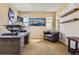 Home office features a large desk, a comfortable chair, and dual windows for natural light at 10935 Valleybrook Cir, Highlands Ranch, CO 80130