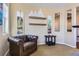 This office area has a comfortable chair, wall art and lighting, and access to an adjacent room at 10935 Valleybrook Cir, Highlands Ranch, CO 80130