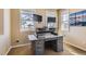 Bright office space includes an adjustable-height desk, natural light, and outlets at 10935 Valleybrook Cir, Highlands Ranch, CO 80130