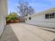 Spacious backyard showcasing a paved patio area, ideal for outdoor entertaining and relaxation at 6863 S Detroit Cir, Centennial, CO 80122