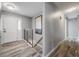 Bright entryway featuring hardwood floors, modern staircase, and fresh paint at 6863 S Detroit Cir, Centennial, CO 80122
