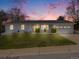 Charming, updated home with freshly painted exterior, a manicured lawn, and an attached two-car garage at 6863 S Detroit Cir, Centennial, CO 80122