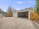Spacious detached garage with ample parking space and potential for storage or workshop area at 6863 S Detroit Cir, Centennial, CO 80122