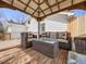 Inviting gazebo on the deck with comfortable seating, perfect for outdoor relaxation and entertaining guests at 6863 S Detroit Cir, Centennial, CO 80122