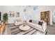Bright, open living room with high ceilings, neutral tones, and stylish furnishings create a comfortable living space at 6863 S Detroit Cir, Centennial, CO 80122