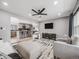 Open concept living room connected to the kitchen, featuring modern decor and ample seating at 6863 S Detroit Cir, Centennial, CO 80122