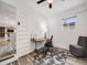 Well-lit office space with wood-style flooring, a modern desk, and comfortable seating at 6863 S Detroit Cir, Centennial, CO 80122