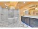 Bright bathroom featuring a soaking tub, walk-in shower, and modern vanity at 10268 Christopher Dr, Conifer, CO 80433