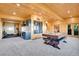 Finished game room featuring a pool table, wet bar, and access to the outdoors at 10268 Christopher Dr, Conifer, CO 80433