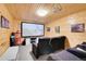 Cozy home theater with comfortable seating and a large projector screen at 10268 Christopher Dr, Conifer, CO 80433
