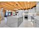 Bright, remodeled kitchen with white cabinets, marble countertops and stainless steel appliances at 10268 Christopher Dr, Conifer, CO 80433