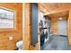 Convenient mud room with washer, dryer, storage, and adjacent half-bathroom at 10268 Christopher Dr, Conifer, CO 80433