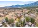 An aerial view of a neighborhood with beautiful mountain views provides a serene backdrop for this home at 3380 Longwood Ave, Boulder, CO 80305