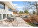 Exterior view of backyard patio with outdoor furniture and mature landscaping at 3380 Longwood Ave, Boulder, CO 80305