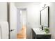 Bright bathroom featuring sleek black fixtures, minimalist decor, and modern vanity at 3380 Longwood Ave, Boulder, CO 80305