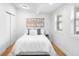 Cozy bedroom with bright white walls, natural light, and hardwood floors at 3380 Longwood Ave, Boulder, CO 80305