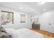 Comfortable bedroom showcasing warm wood floors, light filled windows, and stylish accents at 3380 Longwood Ave, Boulder, CO 80305
