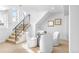 Bright dining space featuring modern chairs, a glass table, and stairs at 3380 Longwood Ave, Boulder, CO 80305