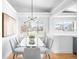 Bright dining room with modern lighting, large windows, and seating for six, perfect for Gathering meals at 3380 Longwood Ave, Boulder, CO 80305