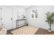 Entryway featuring slate floors, modern decor, and a sun-filled window at 3380 Longwood Ave, Boulder, CO 80305