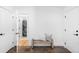 Welcoming entryway with a bench, laundry access, and neutral tones at 3380 Longwood Ave, Boulder, CO 80305