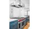 Chef's kitchen features a professional-grade range, custom cabinetry, and stainless steel appliances at 3380 Longwood Ave, Boulder, CO 80305