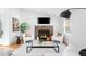 Bright living room featuring a fireplace, neutral decor, and ample seating for relaxation and entertaining at 3380 Longwood Ave, Boulder, CO 80305