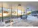 Covered backyard patio with an outdoor dining set and a view of the landscaped yard at 6431 W Arbor Ave, Littleton, CO 80123