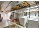 This basement has laundry hookups, built in shelving, and a finished floor at 6431 W Arbor Ave, Littleton, CO 80123