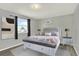 Charming bedroom with a comfortable bed, decorative pillows, and stylish nightstands at 6431 W Arbor Ave, Littleton, CO 80123