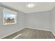 Clean bedroom with soft carpet, neutral walls, and a bright window at 6431 W Arbor Ave, Littleton, CO 80123