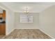 Empty dining room with hardwood floors, lots of light, and neutral paint at 6431 W Arbor Ave, Littleton, CO 80123