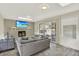 Bright living room with a fireplace, skylights, and a sliding glass door to the backyard patio at 6431 W Arbor Ave, Littleton, CO 80123