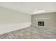 Spacious living room with wood-look flooring and a fireplace with a white mantel at 6431 W Arbor Ave, Littleton, CO 80123