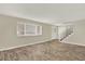 Bright living room featuring hardwood floors, lots of light, and a staircase at 6431 W Arbor Ave, Littleton, CO 80123