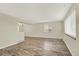 Spacious living area featuring hardwood floors, lots of light, and neutral paint at 6431 W Arbor Ave, Littleton, CO 80123