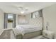 Luxurious primary bedroom with plush carpeting, stylish decor, and ample natural light at 6431 W Arbor Ave, Littleton, CO 80123