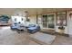This covered patio has ample seating for relaxing and entertaining with access to the backyard at 6431 W Arbor Ave, Littleton, CO 80123