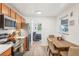 Modern kitchen featuring stainless steel appliances and light wood cabinets at 4240 Harlan St, Wheat Ridge, CO 80033