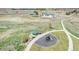 Aerial view showcasing a park with a playground, gazebo, and nearby community amenities, enhancing the neighborhood's appeal at 5736 Cadara Way, Parker, CO 80134