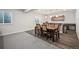 Basement boasts dining area with table, chairs, and adjacent bar, perfect for entertaining guests at 5736 Cadara Way, Parker, CO 80134