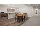 Basement features dining area with table, chairs and bar, perfect for hosting gatherings and entertaining guests at 5736 Cadara Way, Parker, CO 80134