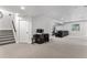 Finished basement featuring carpeted floors and access to a living room and desk area at 5736 Cadara Way, Parker, CO 80134