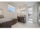 Bright bathroom with granite countertops, dual sinks, and marble tile floors in a modern home at 5736 Cadara Way, Parker, CO 80134