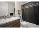 Bathroom boasts a tub with shower, granite countertop vanity and tiled flooring at 5736 Cadara Way, Parker, CO 80134